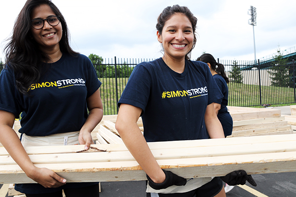 Simon students working with Habitat for Humanity