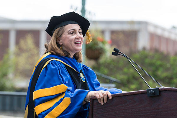 Dean Yeltekin addresses the crowd during commencement